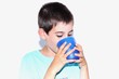 child drinking a glass of water