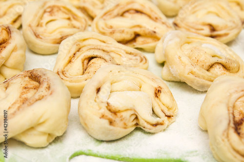 Photo: Half-finished product of a roll with cinnamon Half-finished product of a roll with cinnamon