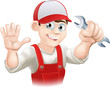 Happy plumber or mechanic with spanner