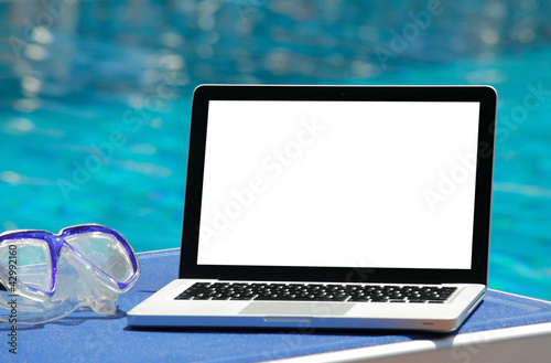 Photo: Laptop by swimming pool Laptop by swimming pool