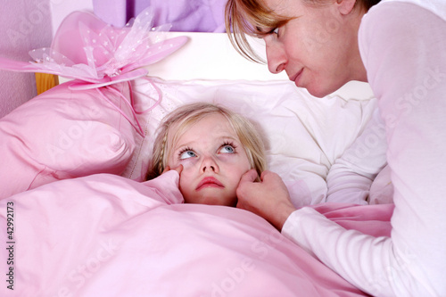 Photo: A woman comforting her terrified daughter A woman comforting her terrified daughter