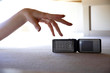 A hand trying to grab a hand phone