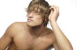Man brushing his hair with a small brush 