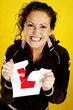 Woman tearing her driving sticker