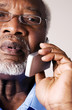 Photo: Senior businessman talking on the hand phone Senior businessman talking on the hand phone