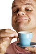 Man smelling his aromatic cup of coffee