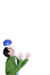 Businessman balancing a soccer ball on his head