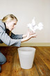 Businesswoman ransacking the dustbin