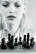 Woman playing chess game