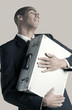 Businessman hugging his briefcase