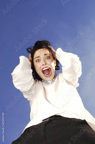 Photo: Woman screaming hysterically Woman screaming hysterically