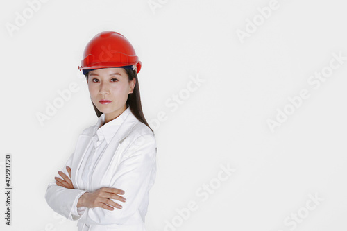 Photo: Businesswoman wearing safety helmet Businesswoman wearing safety helmet