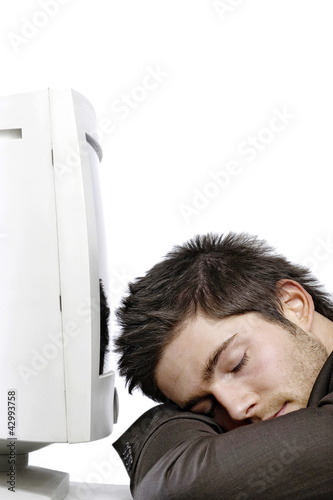 Photo: Man sleeping in front of the computer screen Man sleeping in front of the computer screen