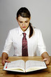 Foto: Businesswoman checking her organizer Businesswoman checking her organizer
