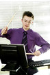 Businessman playing with drum sticks