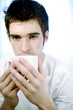 Man drinking a cup of coffee