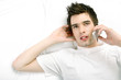 Man lying on the bed talking on the mobile phone