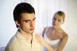 Woman consoling her troubled husband