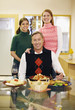 Family posing at the dining table