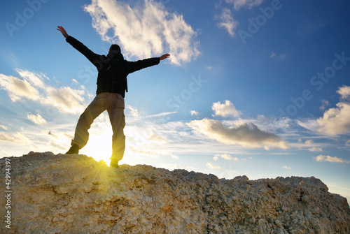 Photo: Man on top of mountain. Man on top of mountain.