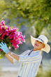 Woman with gloves gardening