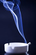 Blue cigarette smoke in black background