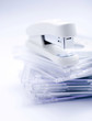 Stapler on top of a stack of CD cases