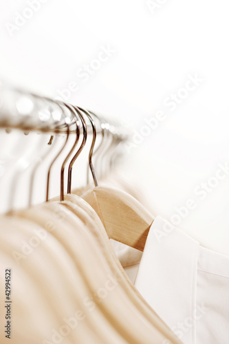 Photo: Shirt hanging on rack Shirt hanging on rack