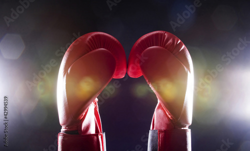 Photo: Two red boxing gloves Two red boxing gloves