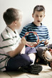 Boys playing with musical instrument