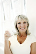 Woman holding a glass of milk