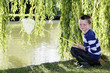 Boy smiling at the camera while holding fishing net