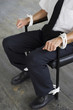 Businessman being tied to a chair