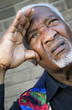 Photo: Senior man shielding his eyes with his hand Senior man shielding his eyes with his hand