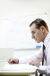 Businessman writing