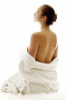 Woman in white bathrobe thinking