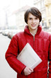 Photo : Man in red jacket holding a file Man in red jacket holding a file