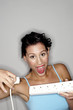 Woman holding an electrical six sockets extension with a plug