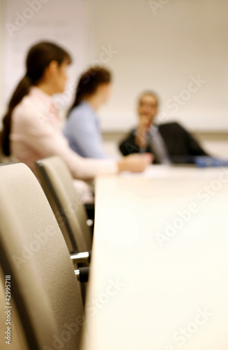 Photo: Business people having discussion in the conference room Business people having discussion in the conference room
