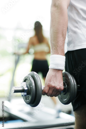 Photo: Man lifting a dumbbell Man lifting a dumbbell