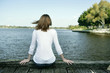 A teenage girl spending time leisurely beside the lake