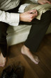Businessman with socks on his lap