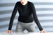 Businesswoman standing with her hands on the table