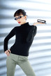 Businesswoman with sunglasses holding an organiser