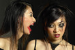 Photo: Woman with smudged lipstick screaming at another woman with smudged mascara Woman with smudged lipstick screaming at another woman with smudged mascara