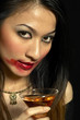 Photo: Woman with smudged lipstick holding a glass of champagne Woman with smudged lipstick holding a glass of champagne