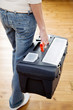 Woman carrying a toolbox