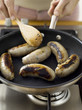 Frying sausages