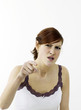 Angry woman pointing at the camera