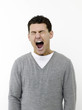 Sleepy man yawning